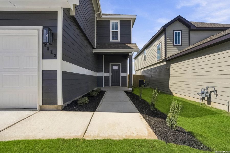 Exterior details and patio area of a home in Hickory Ridge, Elmendorf (Image 4).