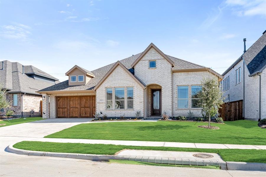 Front exterior of a new home in Sonoma Verde, McLendon-Chisholm, TX, highlighting curb appeal (Image 20).