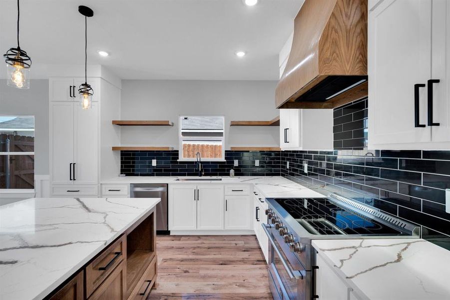 Love the kitchen window and custom design features.