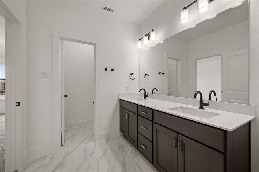 Ample room for two in this beautiful new owner's bath.