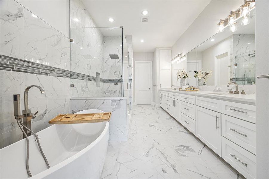 Primary bath with soaking tub that has standing plumbing fixtures. (Similar floor plan)