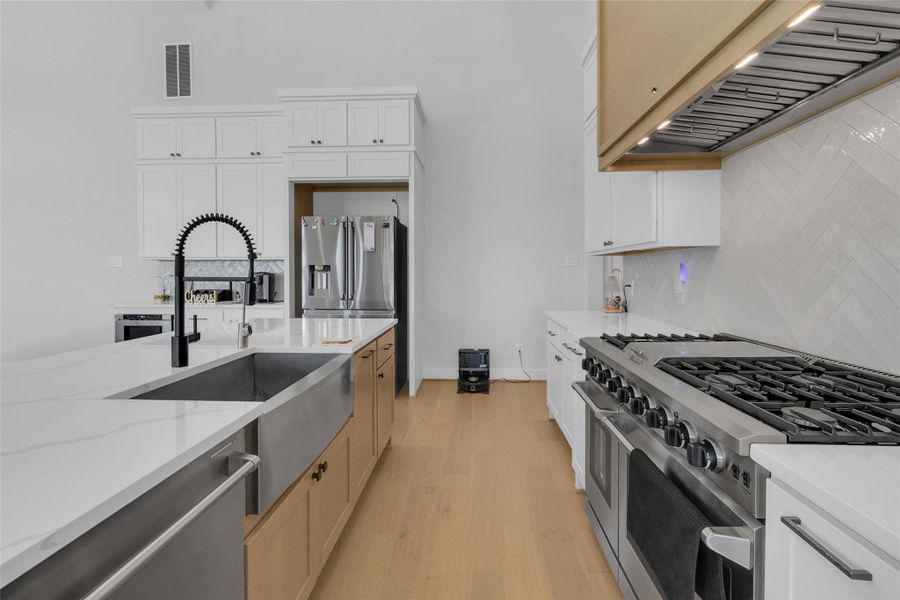 Modern kitchen with premium finishes and stainless steel appliances.