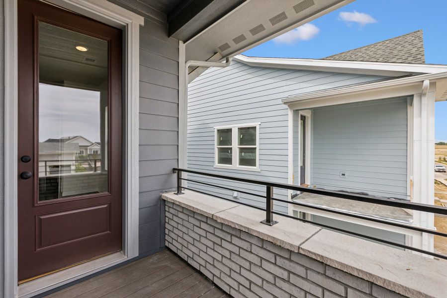 Exterior details and patio area of a home in Kinston Mainstreet Townhomes, Loveland (Image 3). Exterior details and patio area of a home in Kinston Mainstreet Townhomes, Loveland (Image 3).