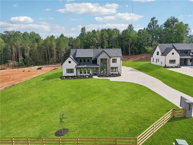 Front exterior of a new home in , Braselton, GA, highlighting curb appeal (Image 56).