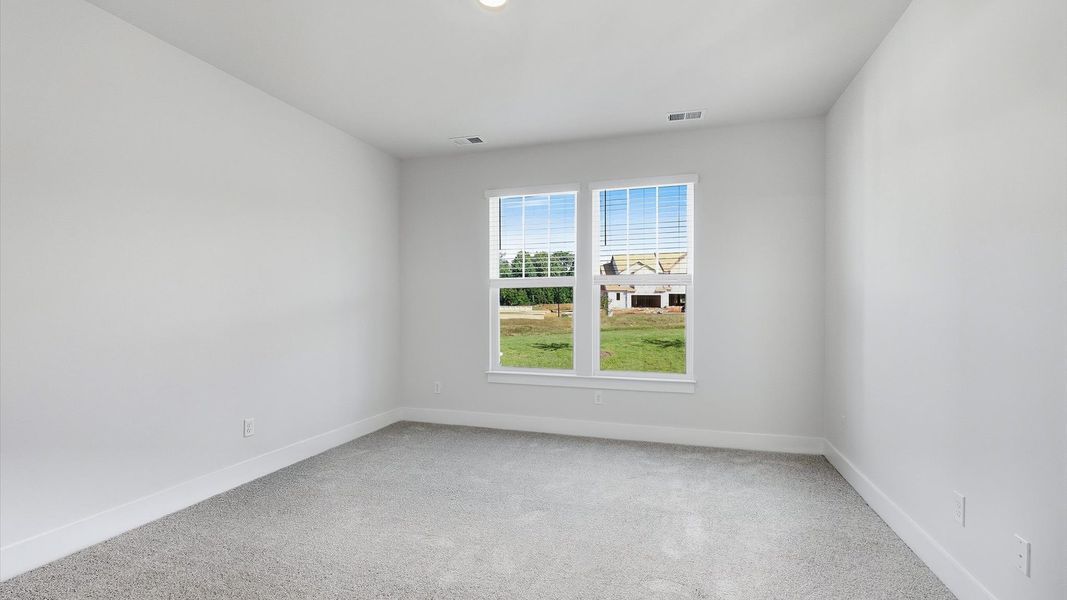 Accomplished design meets restful elegance in this exclusive primary suite by DRB Homes