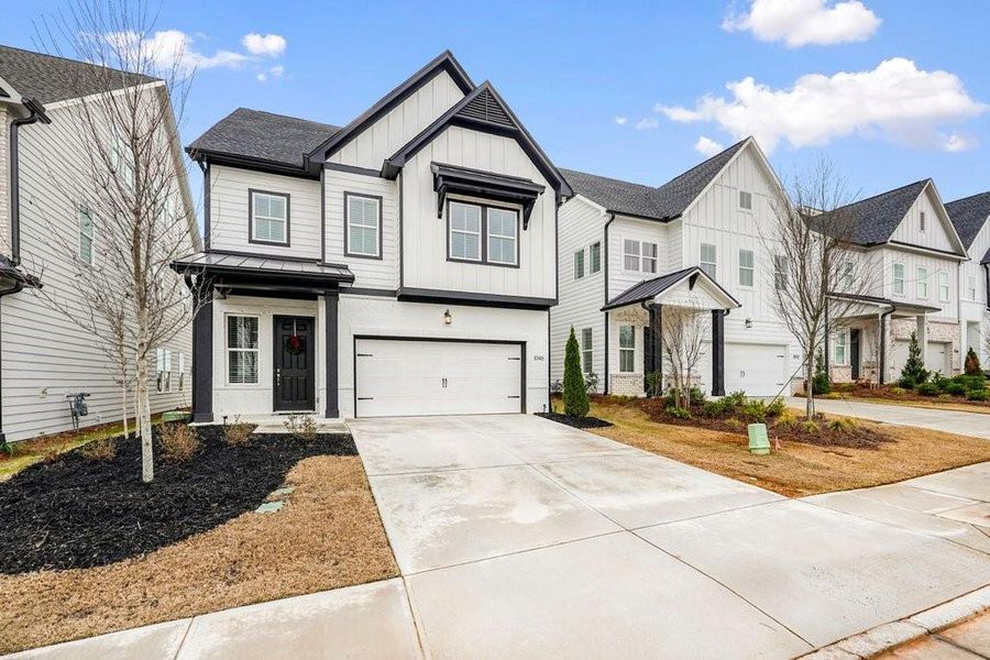 Front exterior of a new home in , Canton, GA, highlighting curb appeal (Image 2). Front exterior of a new home in , Canton, GA, highlighting curb appeal (Image 2).