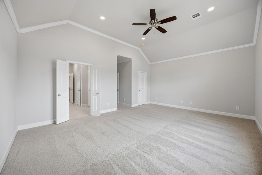 Retreat in Style. With two spacious walk-in closets—one in the bedroom, one in the bath—this vaulted primary suite was designed with real life in mind.