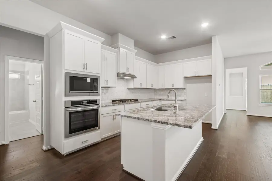 Furnished interior view inside a new home in Sunterra, Katy (Image 6).