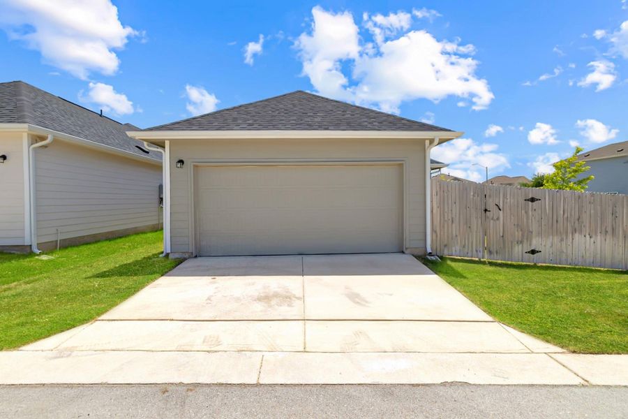 Garage featuring driveway Garage featuring driveway