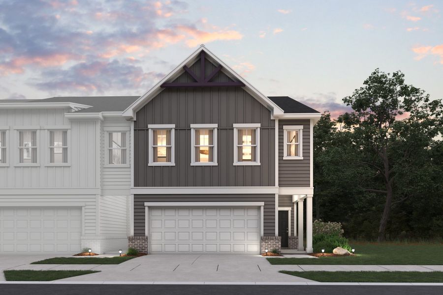 A grey house with a garage.