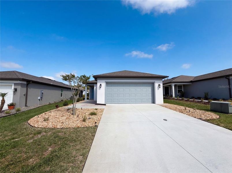 Front exterior of a new home in , Ocala, FL, highlighting curb appeal (Image 2). Front exterior of a new home in , Ocala, FL, highlighting curb appeal (Image 2).