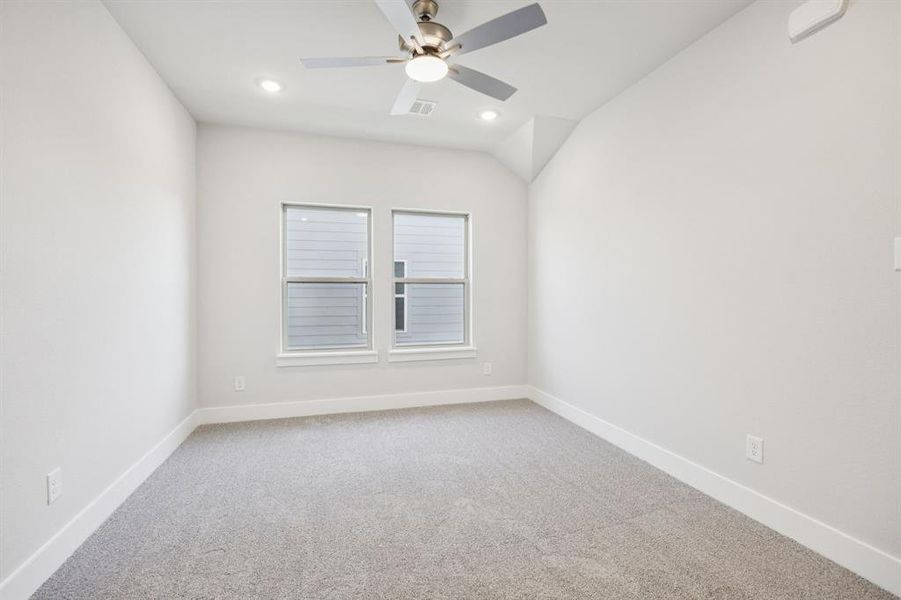 Unfurnished room with light carpet, recessed lighting, ceiling fan, and vaulted ceiling