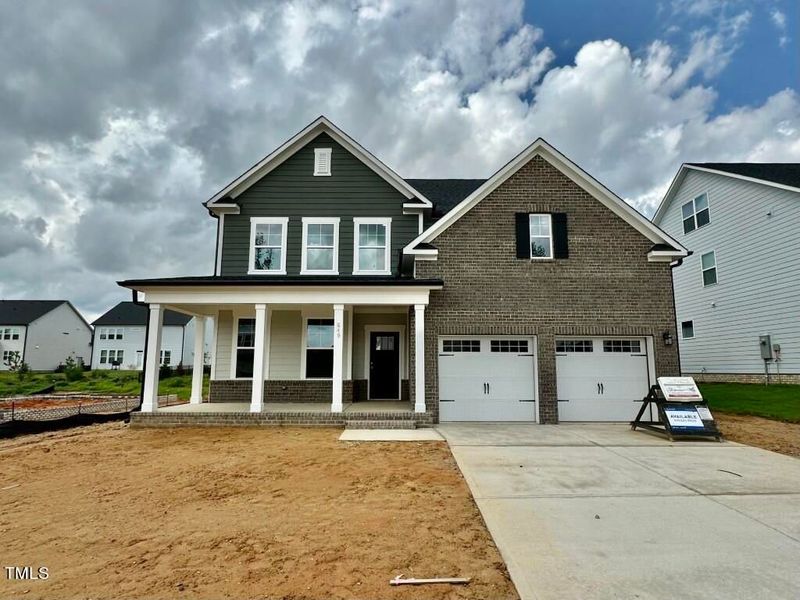 Front exterior of a new home in Glenmere, Knightdale, NC, highlighting curb appeal (Image 5). Front exterior of a new home in Glenmere, Knightdale, NC, highlighting curb appeal (Image 5).