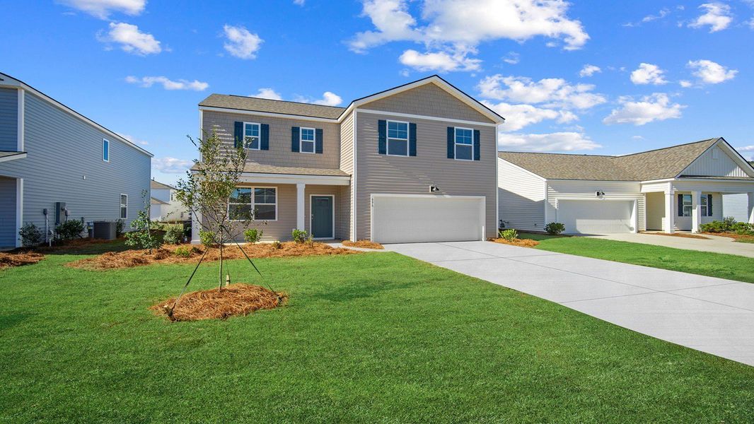 Front exterior of a new home in The Retreat at East Argent, Ridgeland, SC, highlighting curb appeal (Image 2). Front exterior of a new home in The Retreat at East Argent, Ridgeland, SC, highlighting curb appeal (Image 2).