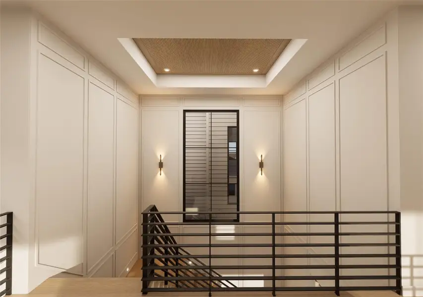 An architectural moment unto itself, this upper landing is wrapped in classic panel molding and crowned by a recessed wood-slat ceiling that adds warmth and dimension. Soft wall sconces cast an ambient glow, elevating the transition between levels into a refined design statement. An architectural moment unto itself, this upper landing is wrapped in classic panel molding and crowned by a recessed wood-slat ceiling that adds warmth and dimension. Soft wall sconces cast an ambient glow, elevating the transition between levels into a refined design statement.