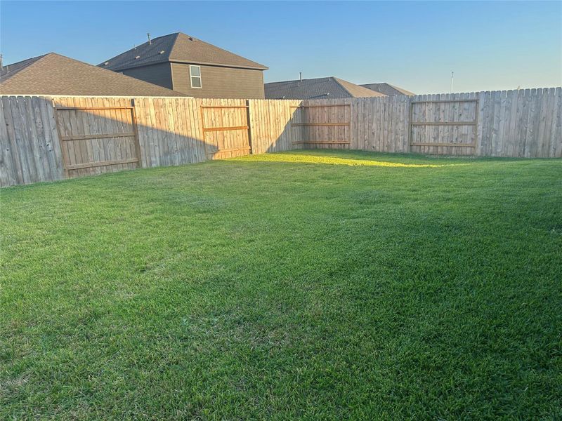 The full wood fence shows the large back yard and full sodded yard. The full wood fence shows the large back yard and full sodded yard.