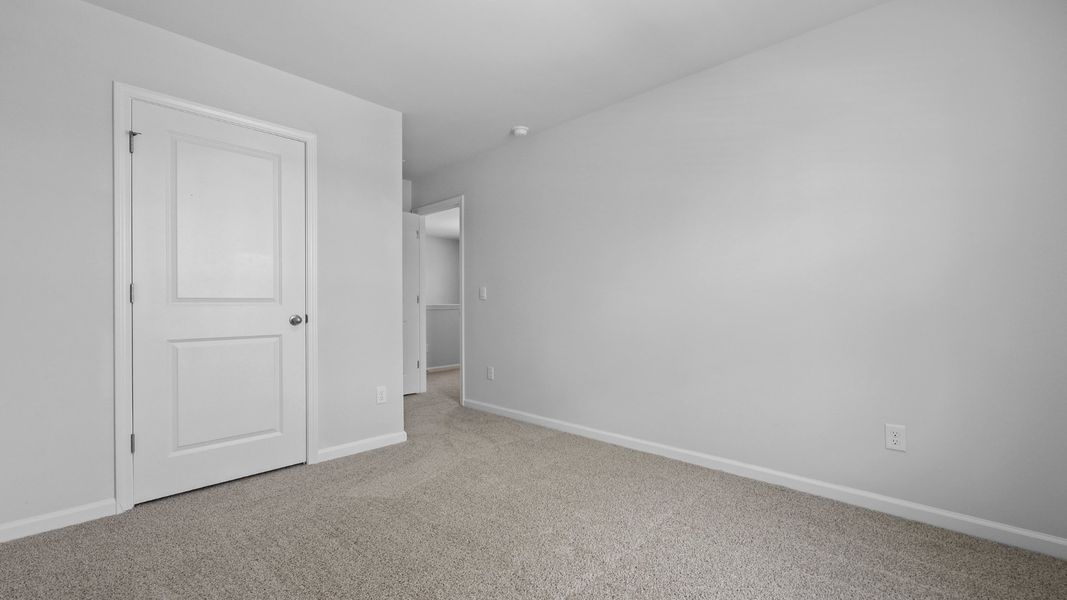 Representative unfurnished interior of a home built from the Aisle by D.R. Horton in Pine Hills at Cane Bay, Summerville (Image 22).
