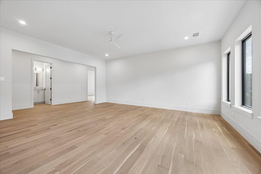 Open sightlines and an expansive layout offer endless flexibility for a media room, game space, or second living area. A dedicated half bath just steps away makes this the ideal gathering space for family and guests among the home’s four upstairs bedrooms.