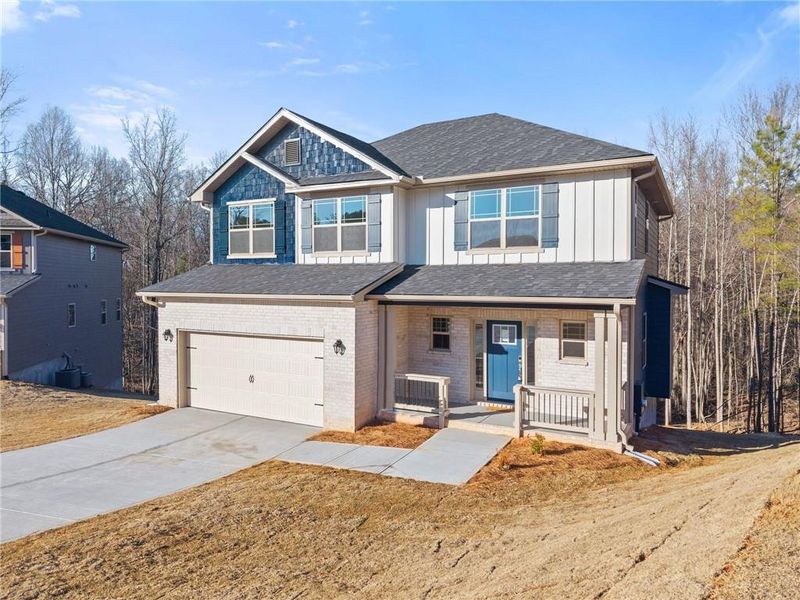 Front exterior of a new home in Magnolia Villas, Cornelia, GA, highlighting curb appeal (Image 21).