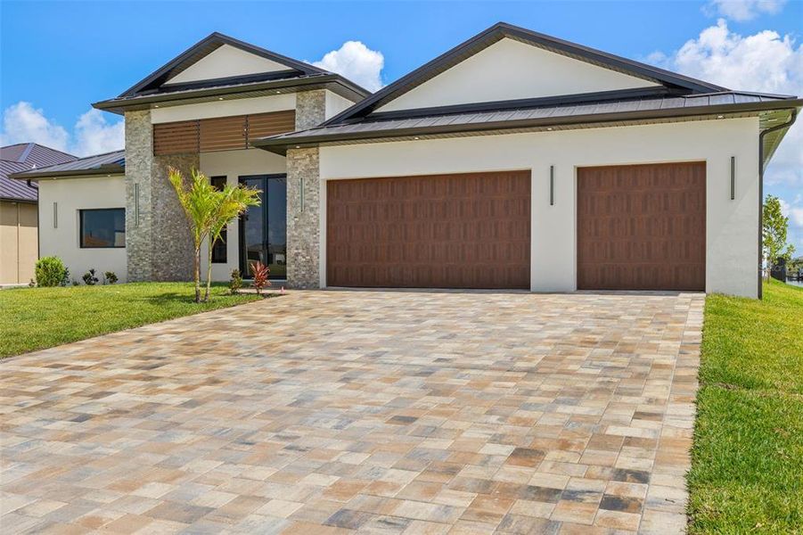 Front exterior of a new home in , Cape Coral, FL, highlighting curb appeal (Image 24).