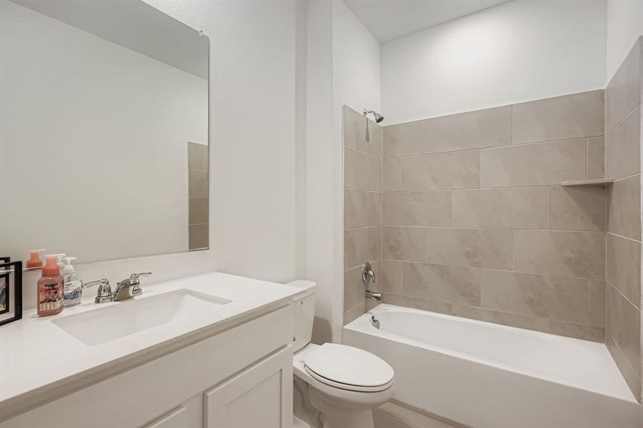 Full bath with shower / washtub combination and vanity