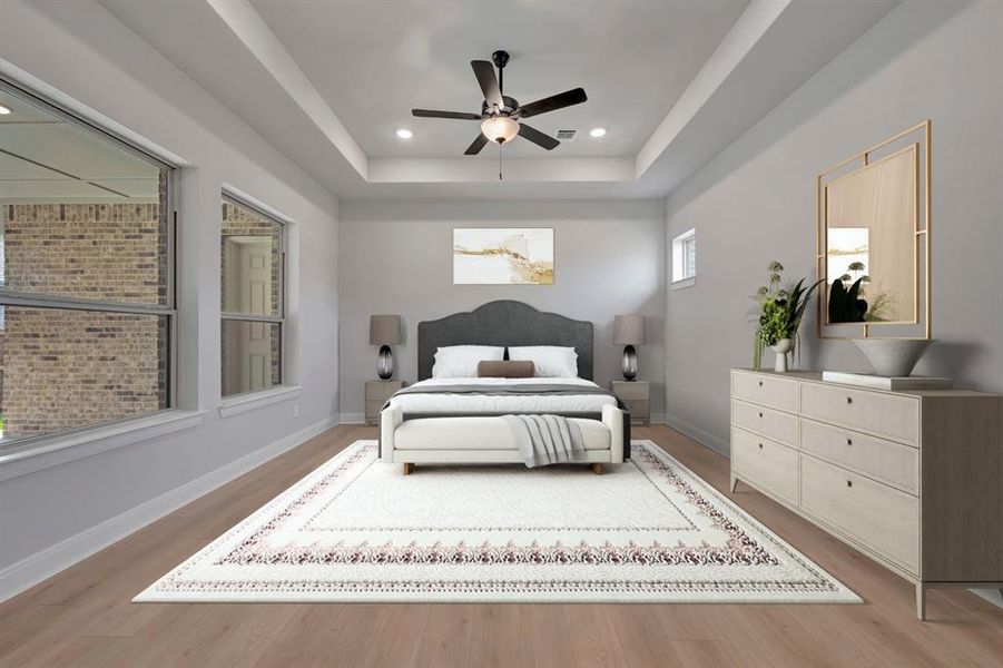 Bedroom with a raised ceiling, a ceiling fan, light wood-type flooring, and recessed lighting