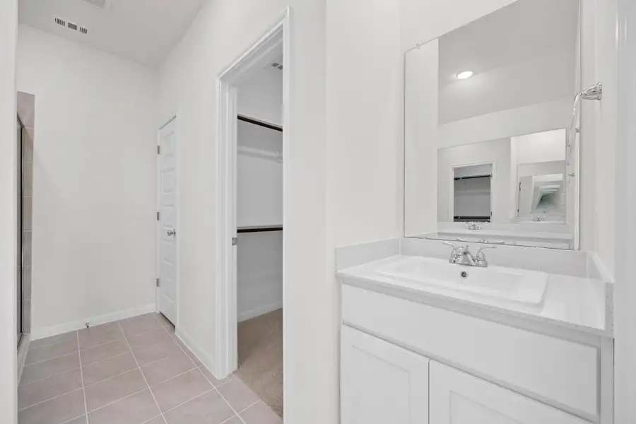 Primary Bathroom in the Cypress home plan by Trophy Signature Homes - REPRESENTATIVE PHOTO