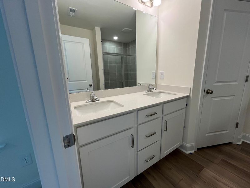 Primary ensuite bath with daul vanities