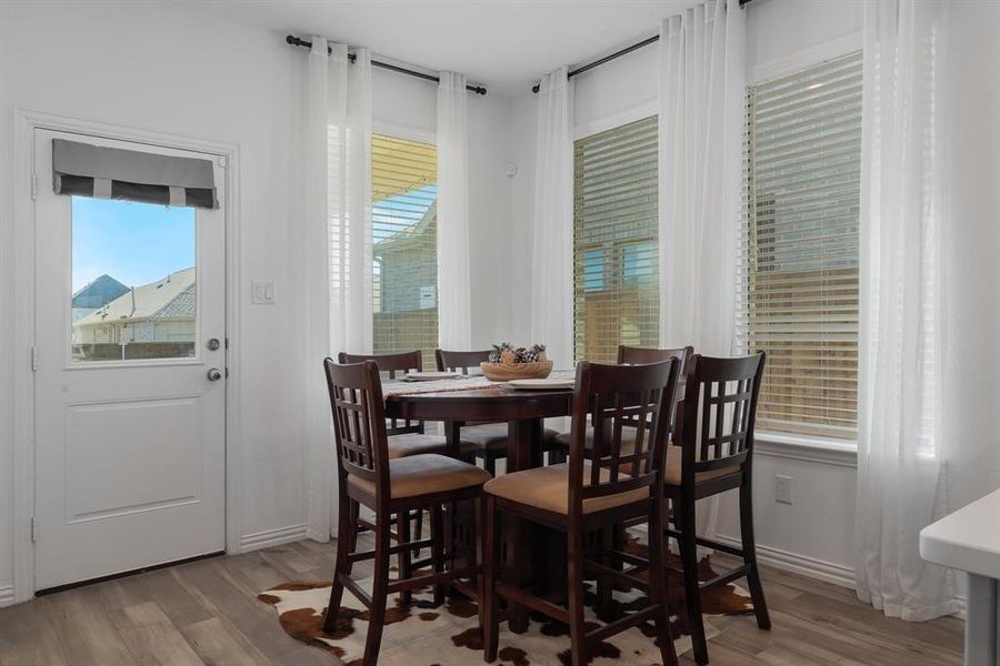 Dining space featuring a wealth of natural light and light wood-type flooring