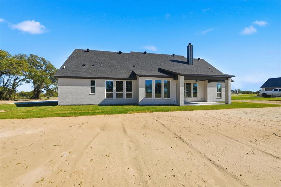 Front exterior of a new home in , Poolville, TX, highlighting curb appeal (Image 26).