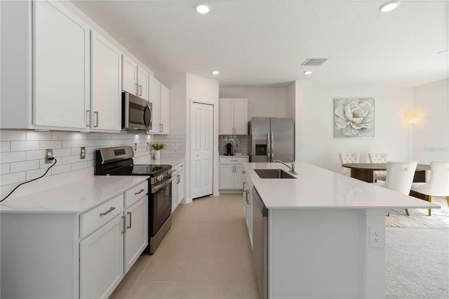 Furnished interior view inside a new home in Peace Creek Reserve: Manor Key Collection, Winter Haven (Image 14).