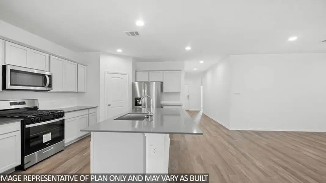 Furnished interior view inside a new home in Sunterra, Katy (Image 6).