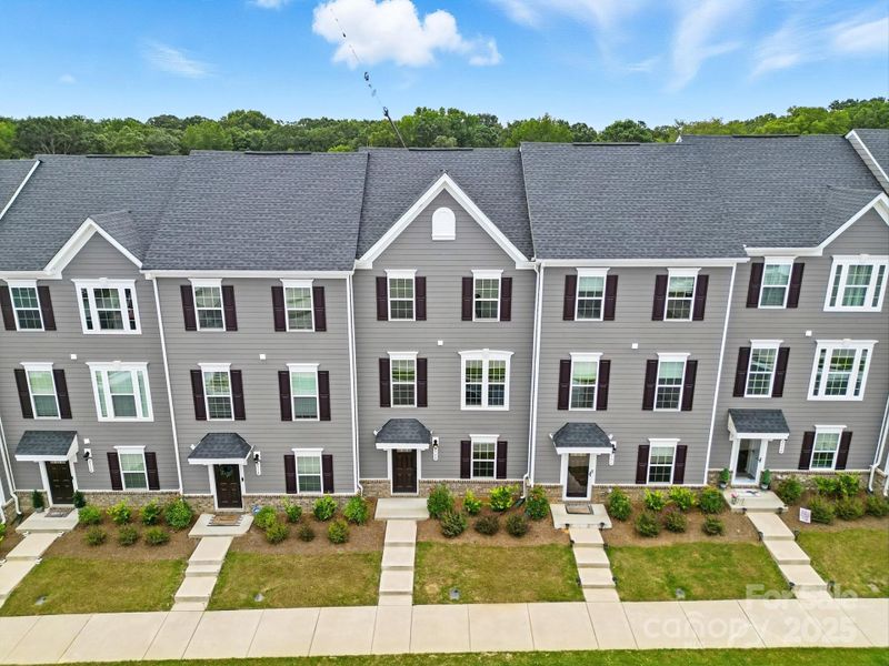 Front exterior of a new home in , Matthews, NC, highlighting curb appeal (Image 25).