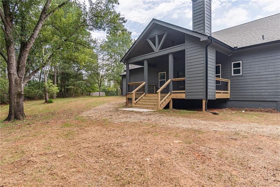 Front exterior of a new home in , Braselton, GA, highlighting curb appeal (Image 1).
