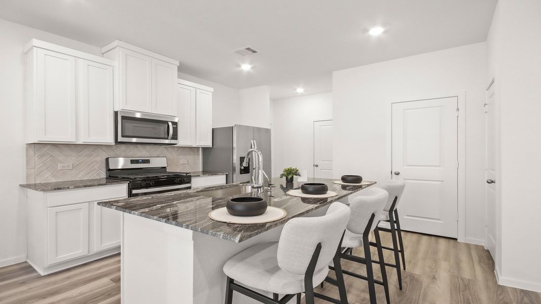 Representative furnished interior of a home built from the 1293 by D.R. Horton in Bridges on Lake Houston Villas, Humble (Image 6).