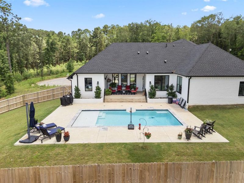 View of pool featuring a patio and grilling area View of pool featuring a patio and grilling area