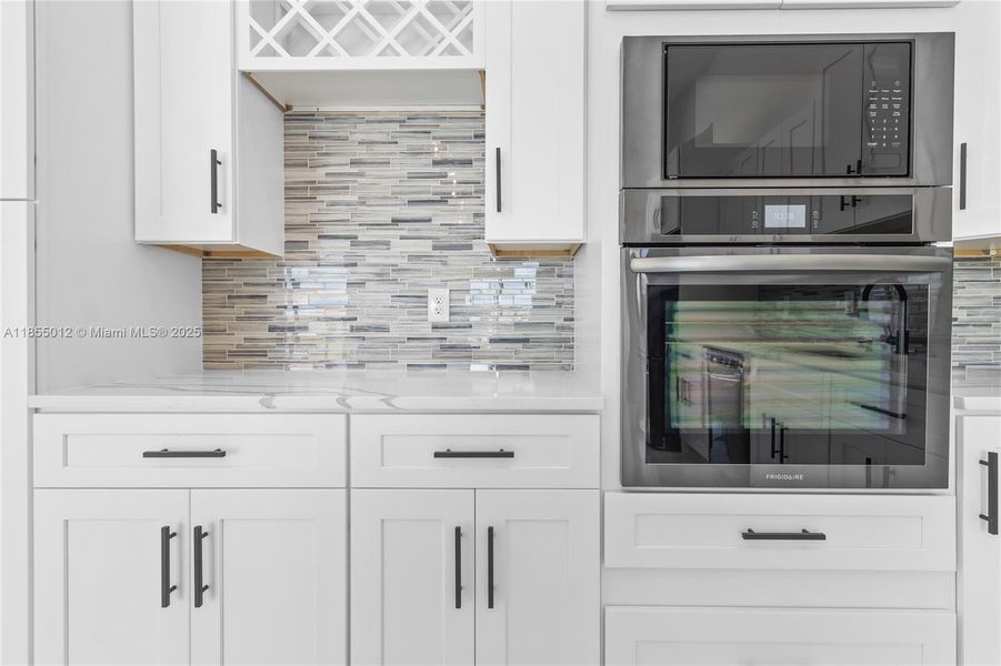 Stunning Black and White Contrast throughout with custom backsplash