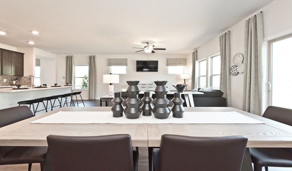 The dining table fits perfectly at the heart of the open-concept living area.