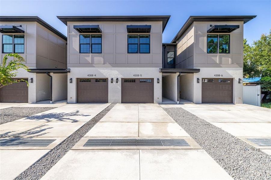 Front exterior of a new home in , Tampa, FL, highlighting curb appeal (Image 24).