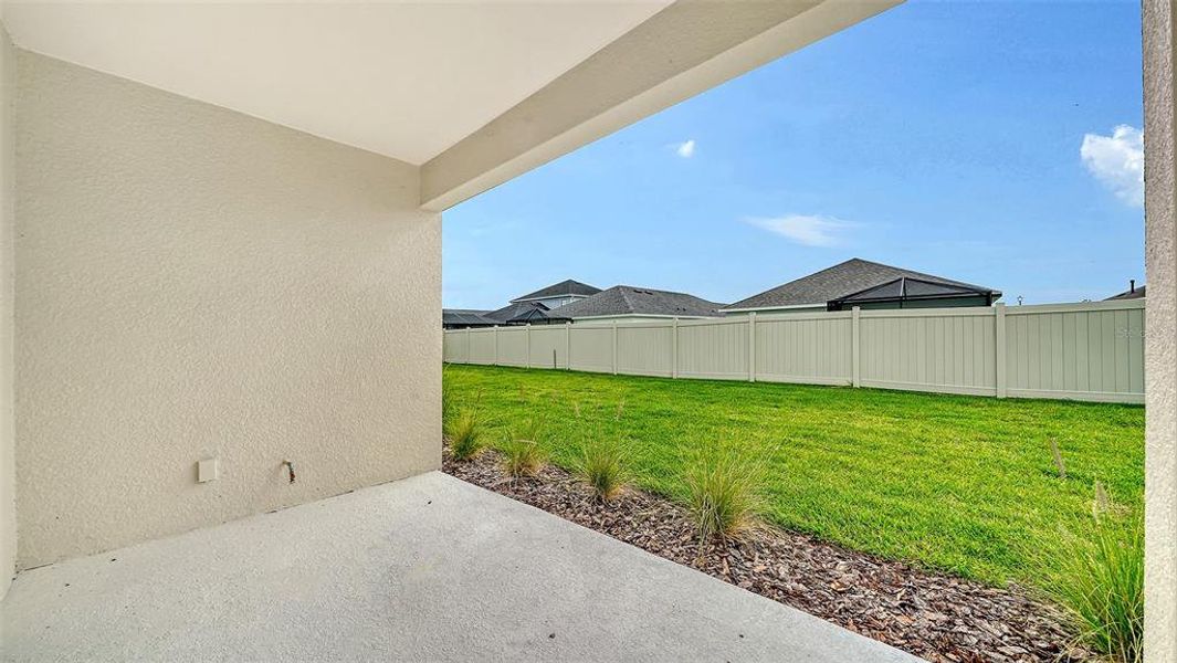 Exterior details and patio area of a home in Canoe Creek, Parrish (Image 3).