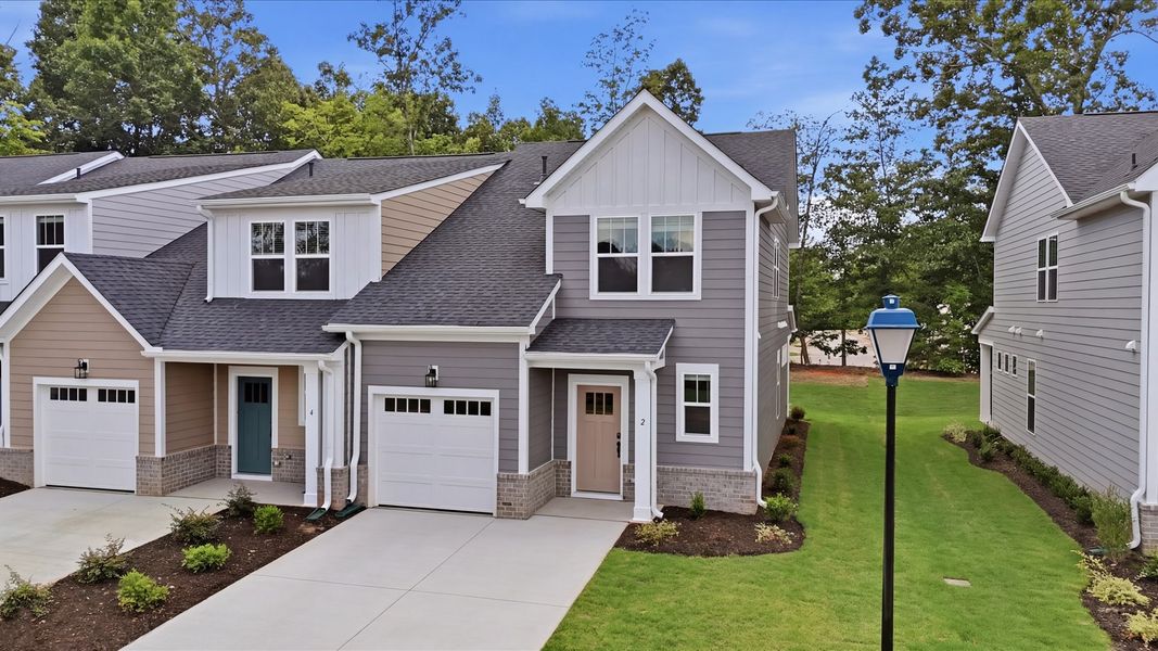 Front exterior of a new home in Pelham Crossing Villas, Greenville, SC, highlighting curb appeal (Image 24). Front exterior of a new home in Pelham Crossing Villas, Greenville, SC, highlighting curb appeal (Image 24).
