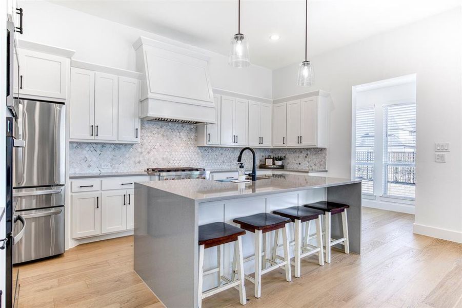 Stunning white kitchen with tons of upgrades including quartz countertops!
