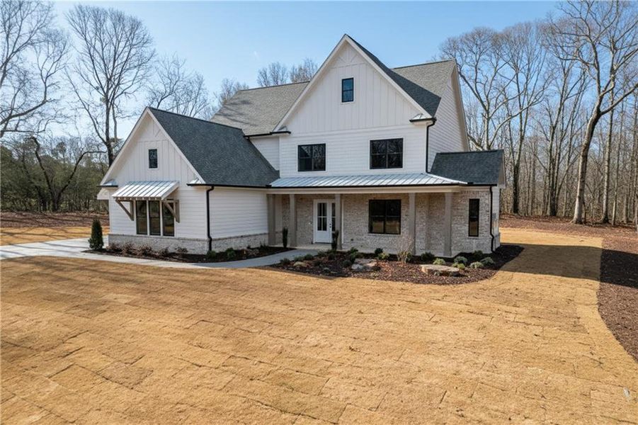 Front exterior of a new home in , Pendergrass, GA, highlighting curb appeal (Image 1). Front exterior of a new home in , Pendergrass, GA, highlighting curb appeal (Image 1).