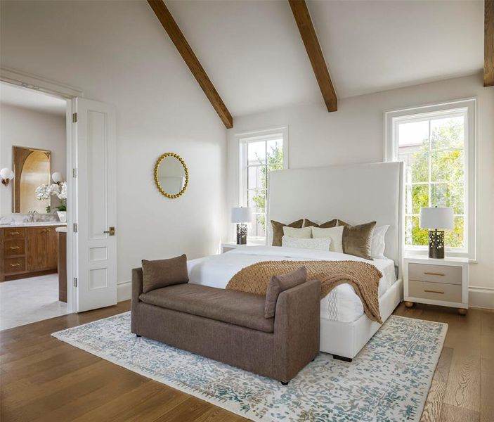 Bedroom with wood finished floors and ensuite bathroom Bedroom with wood finished floors and ensuite bathroom