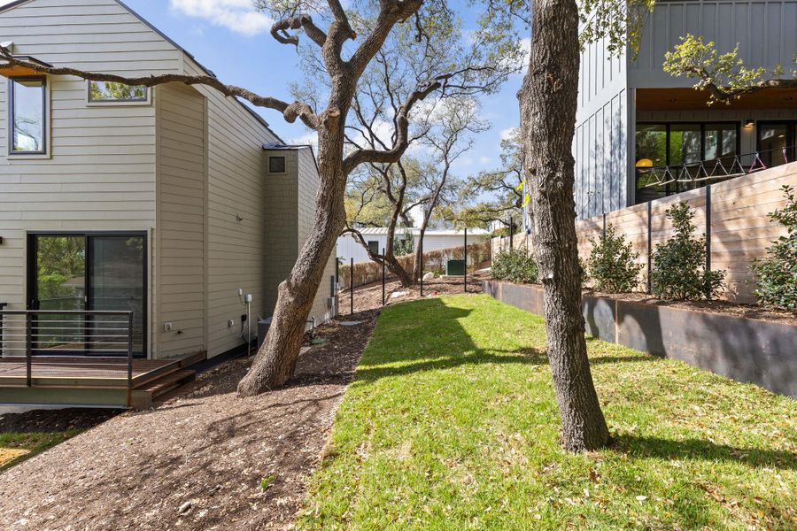 Fenced yard with a deck