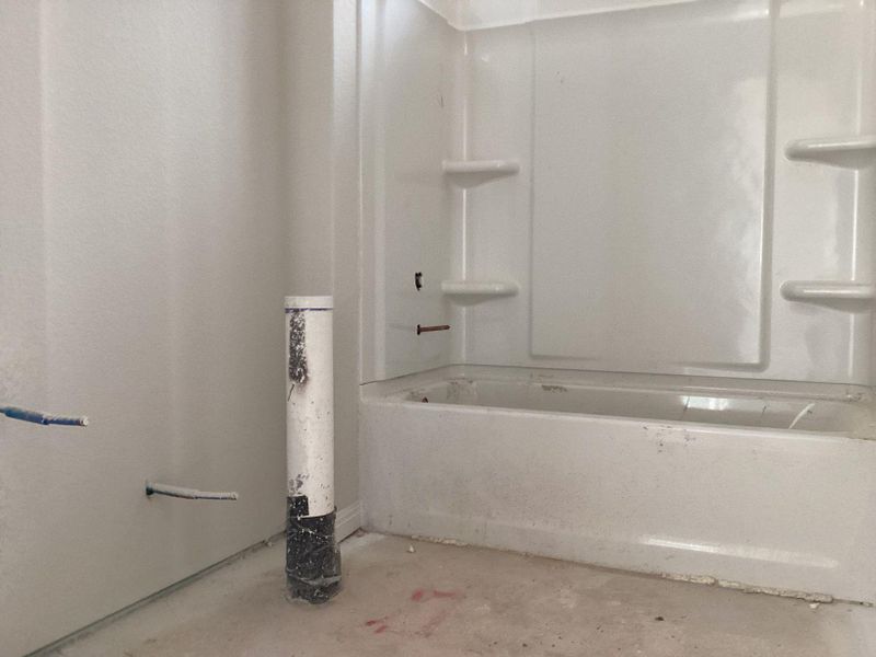 In-progress construction of a new home in The Cottages at Lariat, Liberty Hill, TX (Image 24).