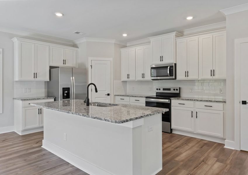 The kitchen island has lots of space for meal prep