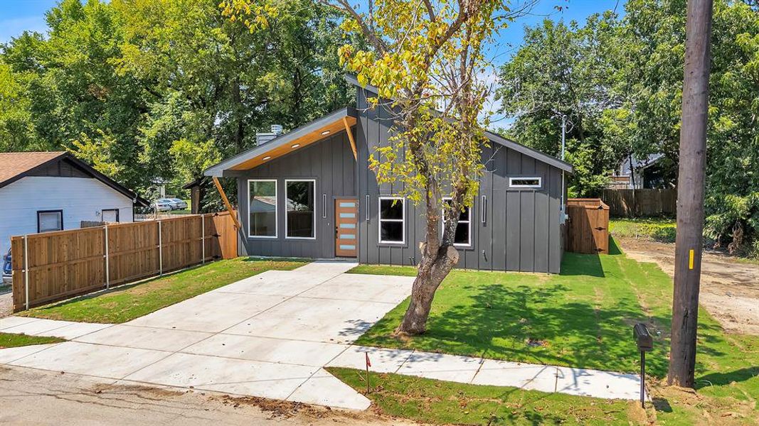 Front exterior of a new home in , Greenville, TX, highlighting curb appeal (Image 2). Front exterior of a new home in , Greenville, TX, highlighting curb appeal (Image 2).