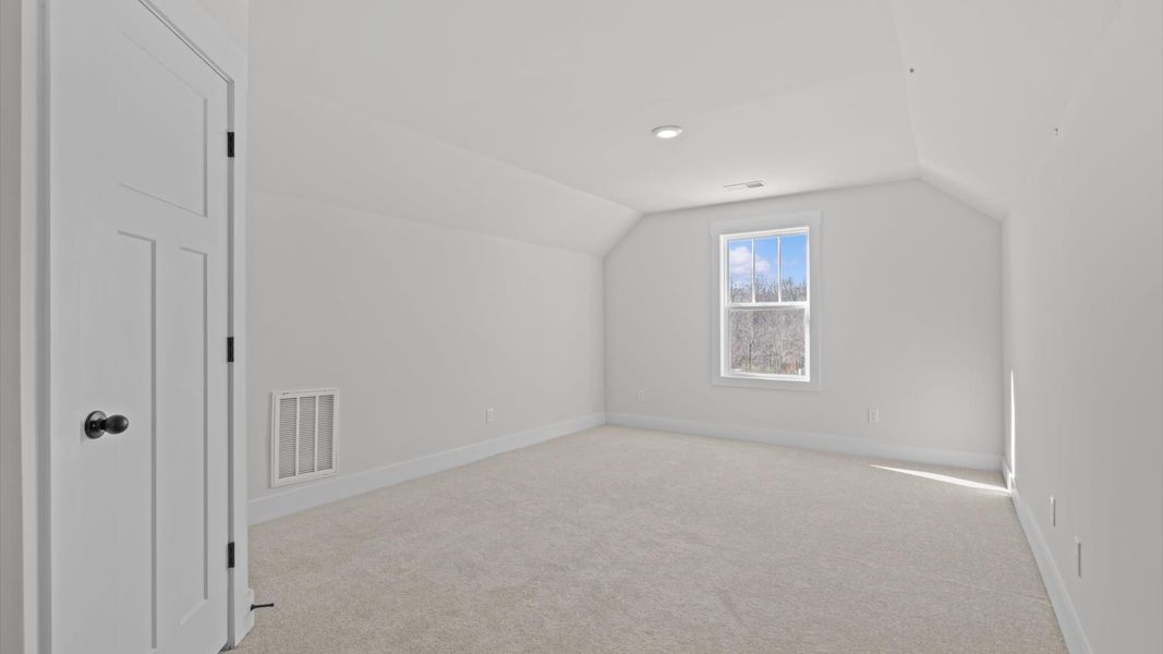 Vibrant and restful bedroom with oversized windows, refined detail, and a warm, welcoming atmosphere