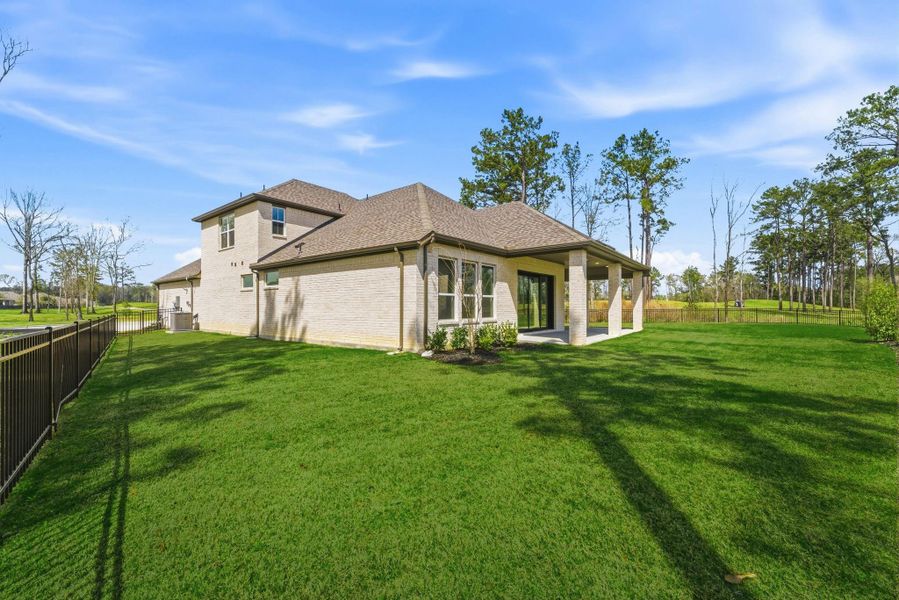 Exterior details and patio area of a home in The Highlands, Porter (Image 27).